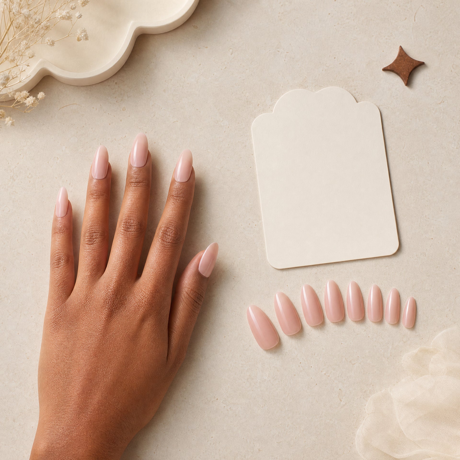 A press-on nail size selection scene with blush almond nails and a fitting card